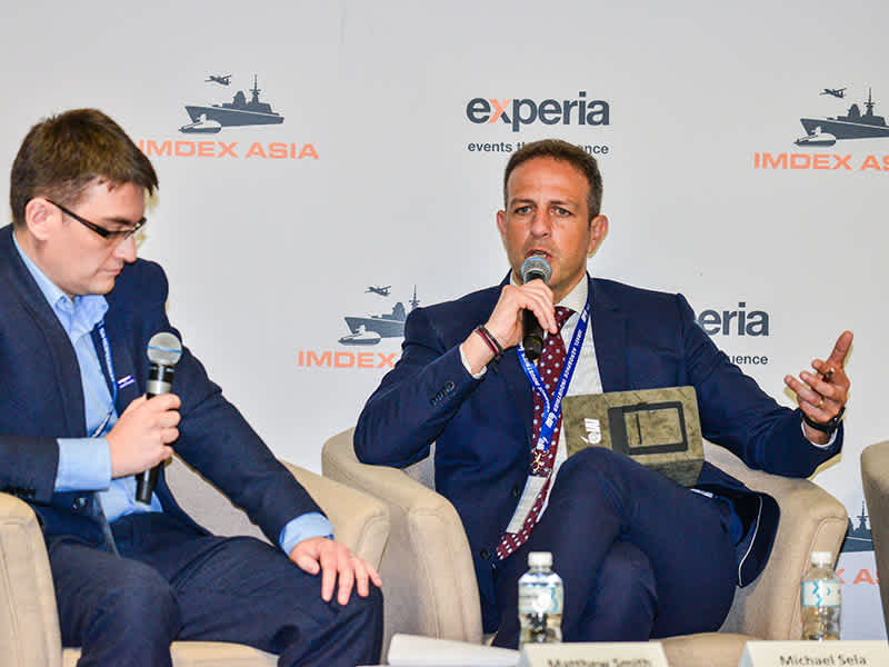 Industry leaders discussing issues and trends related to maritime and defence at IMDEX Asia conference.